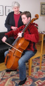 Jane adjusting a cello player's form